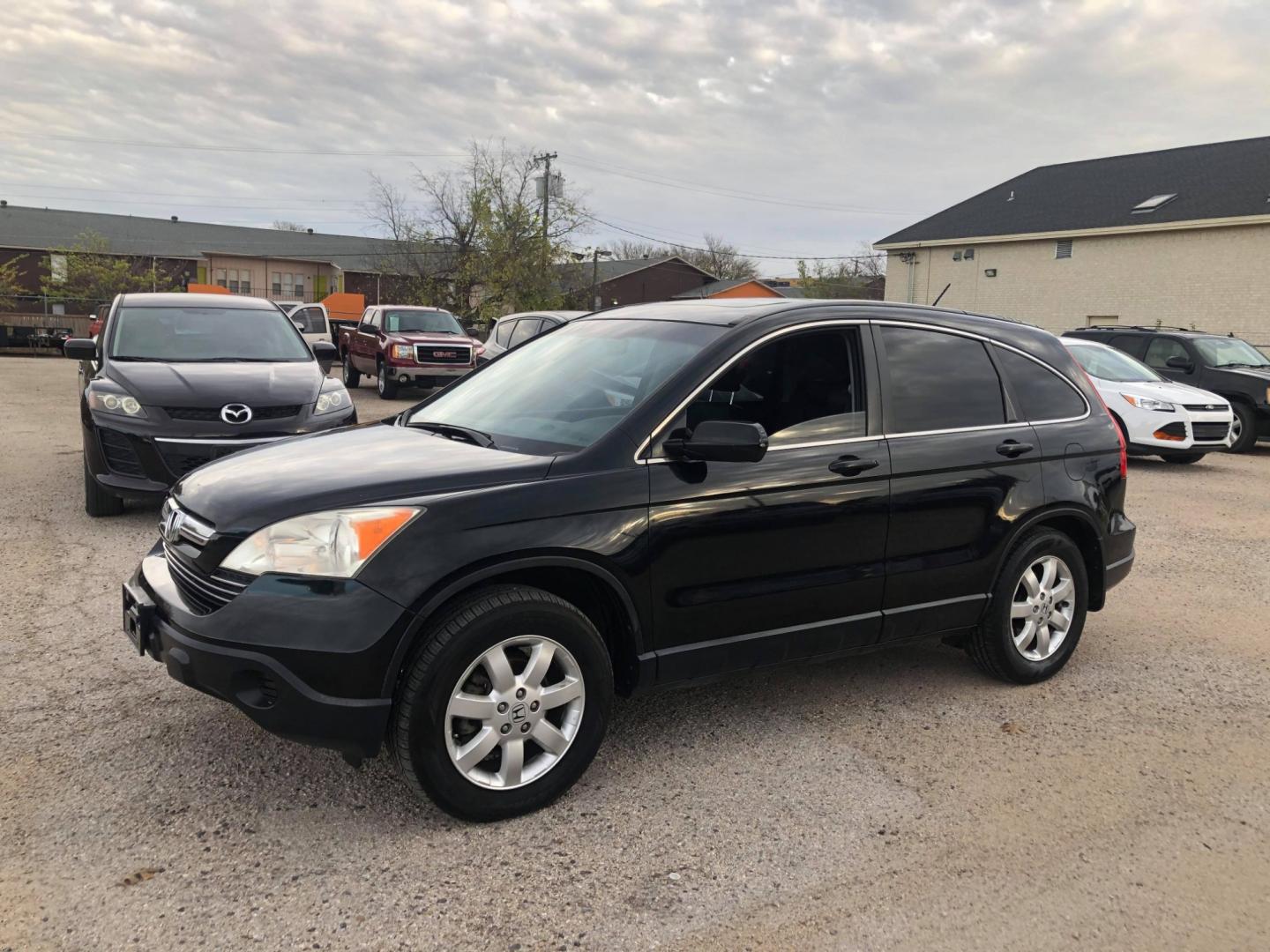 2007 Black Honda CR-V EX-L 2WD AT (JHLRE38727C) with an 2.4L L4 DOHC 16V engine, Automatic transmission, located at 1830 North Belt Line Road, Irving, TX, 75061, (469) 524-0199, 32.834373, -96.993584 - Photo#2