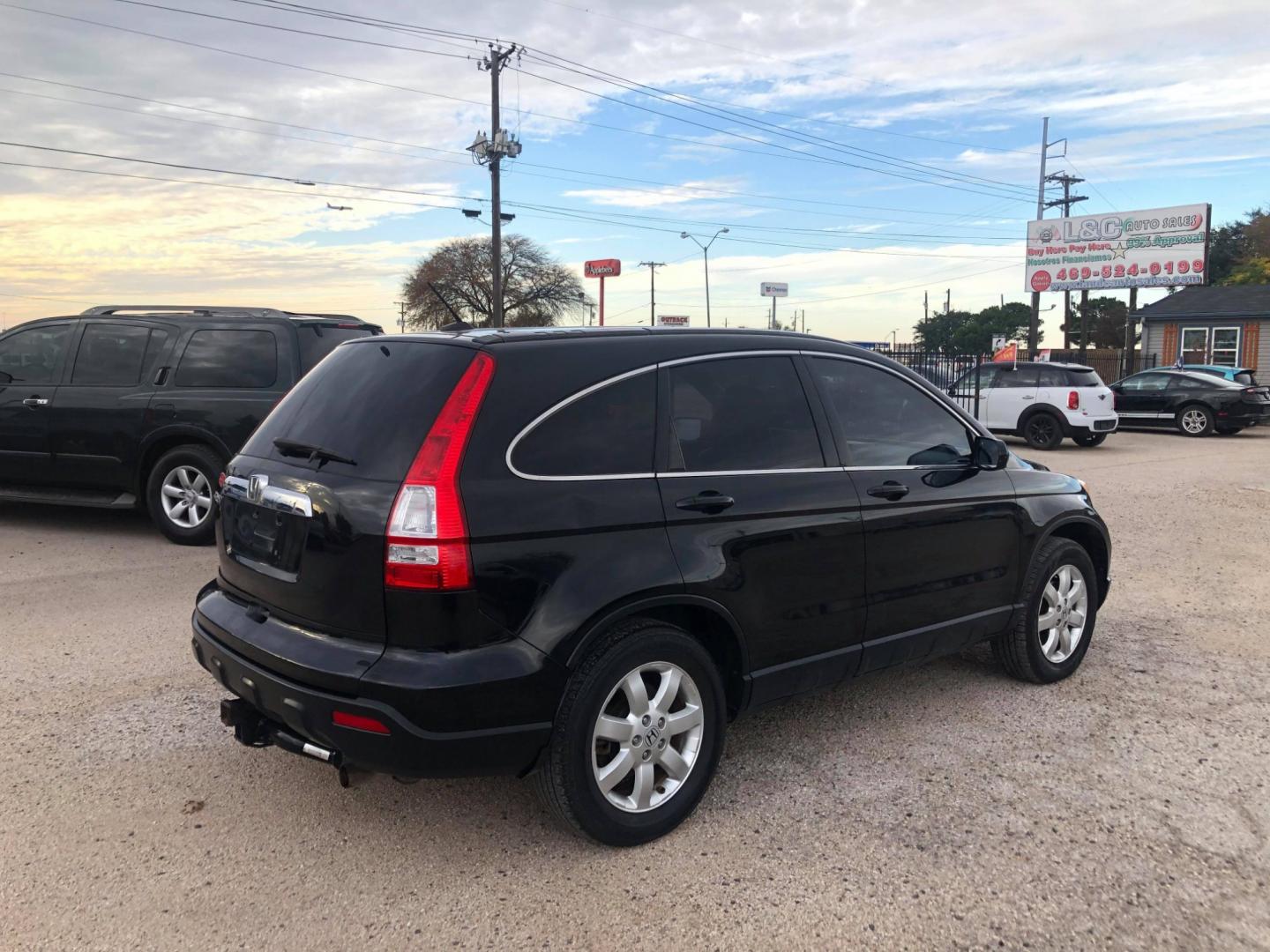 2007 Black Honda CR-V EX-L 2WD AT (JHLRE38727C) with an 2.4L L4 DOHC 16V engine, Automatic transmission, located at 1830 North Belt Line Road, Irving, TX, 75061, (469) 524-0199, 32.834373, -96.993584 - Photo#3