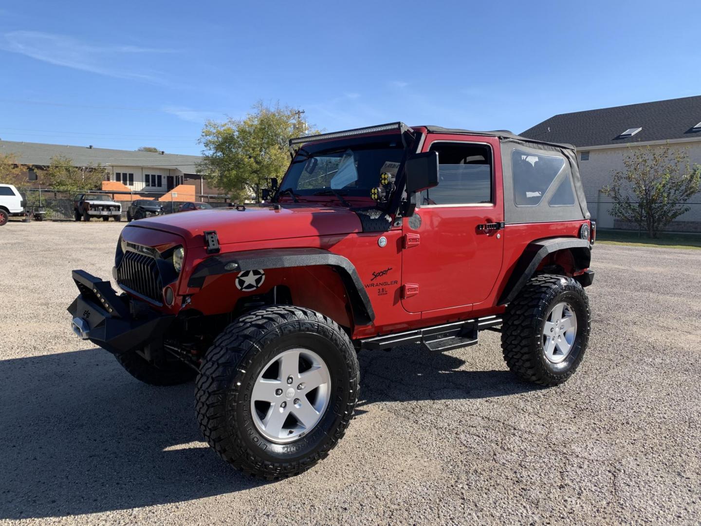 2011 Red /Black Jeep Wrangler Sport 4WD (1J4AA2D12BL) with an 3.8L V6 OHV 12V engine, Auto transmission, located at 1830 North Belt Line Road, Irving, TX, 75061, (469) 524-0199, 32.834373, -96.993584 - Photo#2