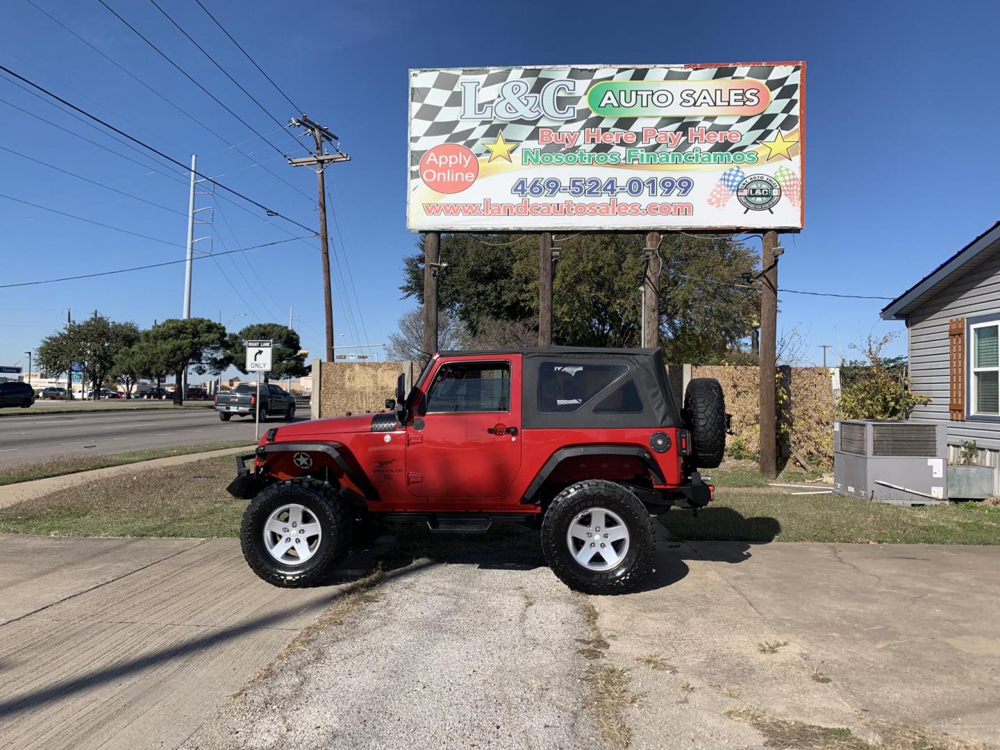 2011 Red /Black Jeep Wrangler Sport 4WD (1J4AA2D12BL) with an 3.8L V6 OHV 12V engine, Auto transmission, located at 1830 North Belt Line Road, Irving, TX, 75061, (469) 524-0199, 32.834373, -96.993584 - Photo#0