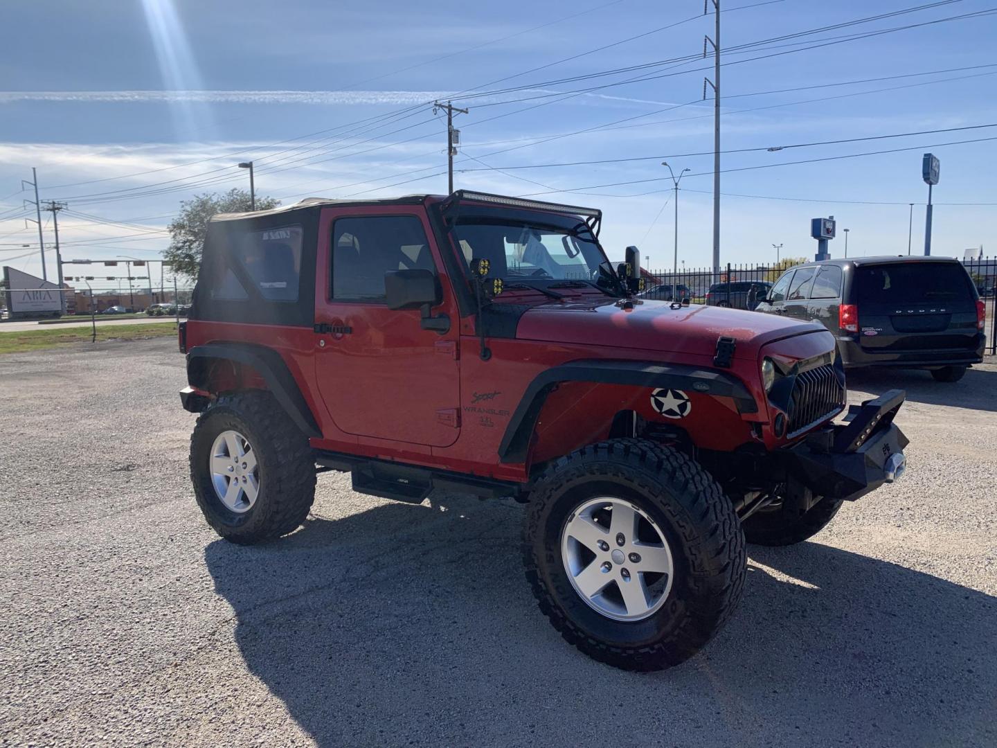 2011 Red /Black Jeep Wrangler Sport 4WD (1J4AA2D12BL) with an 3.8L V6 OHV 12V engine, Auto transmission, located at 1830 North Belt Line Road, Irving, TX, 75061, (469) 524-0199, 32.834373, -96.993584 - Photo#4