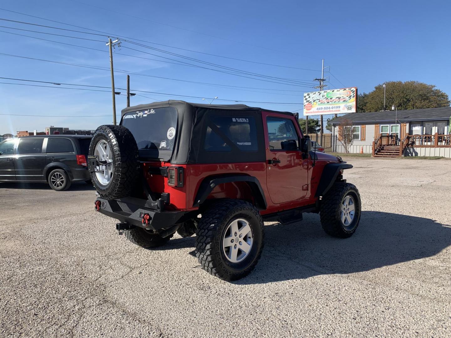 2011 Red /Black Jeep Wrangler Sport 4WD (1J4AA2D12BL) with an 3.8L V6 OHV 12V engine, Auto transmission, located at 1830 North Belt Line Road, Irving, TX, 75061, (469) 524-0199, 32.834373, -96.993584 - Photo#5