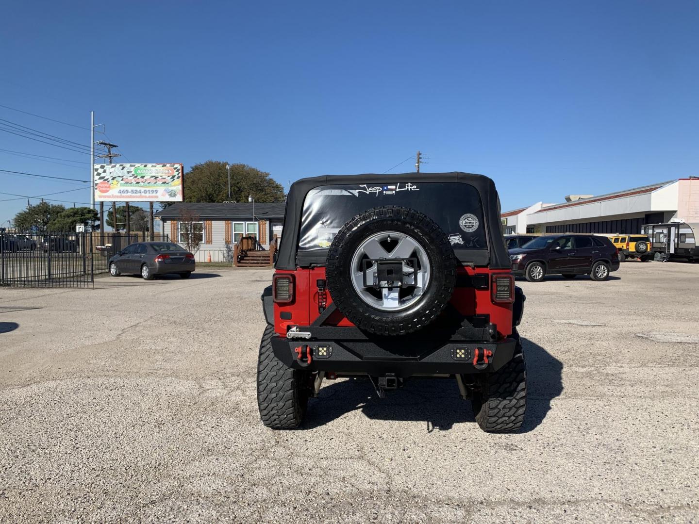 2011 Red /Black Jeep Wrangler Sport 4WD (1J4AA2D12BL) with an 3.8L V6 OHV 12V engine, Auto transmission, located at 1830 North Belt Line Road, Irving, TX, 75061, (469) 524-0199, 32.834373, -96.993584 - Photo#6