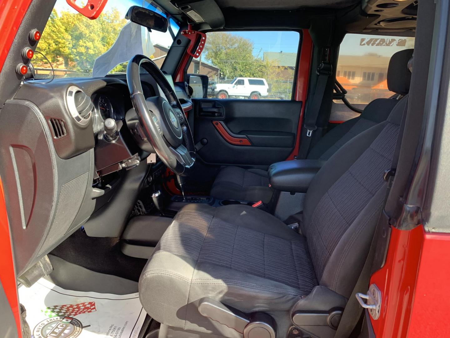 2011 Red /Black Jeep Wrangler Sport 4WD (1J4AA2D12BL) with an 3.8L V6 OHV 12V engine, Auto transmission, located at 1830 North Belt Line Road, Irving, TX, 75061, (469) 524-0199, 32.834373, -96.993584 - Photo#7