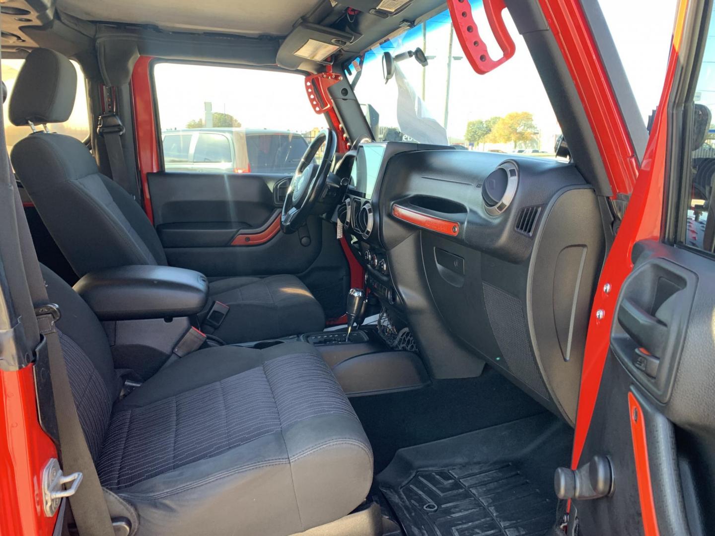 2011 Red /Black Jeep Wrangler Sport 4WD (1J4AA2D12BL) with an 3.8L V6 OHV 12V engine, Auto transmission, located at 1830 North Belt Line Road, Irving, TX, 75061, (469) 524-0199, 32.834373, -96.993584 - Photo#9