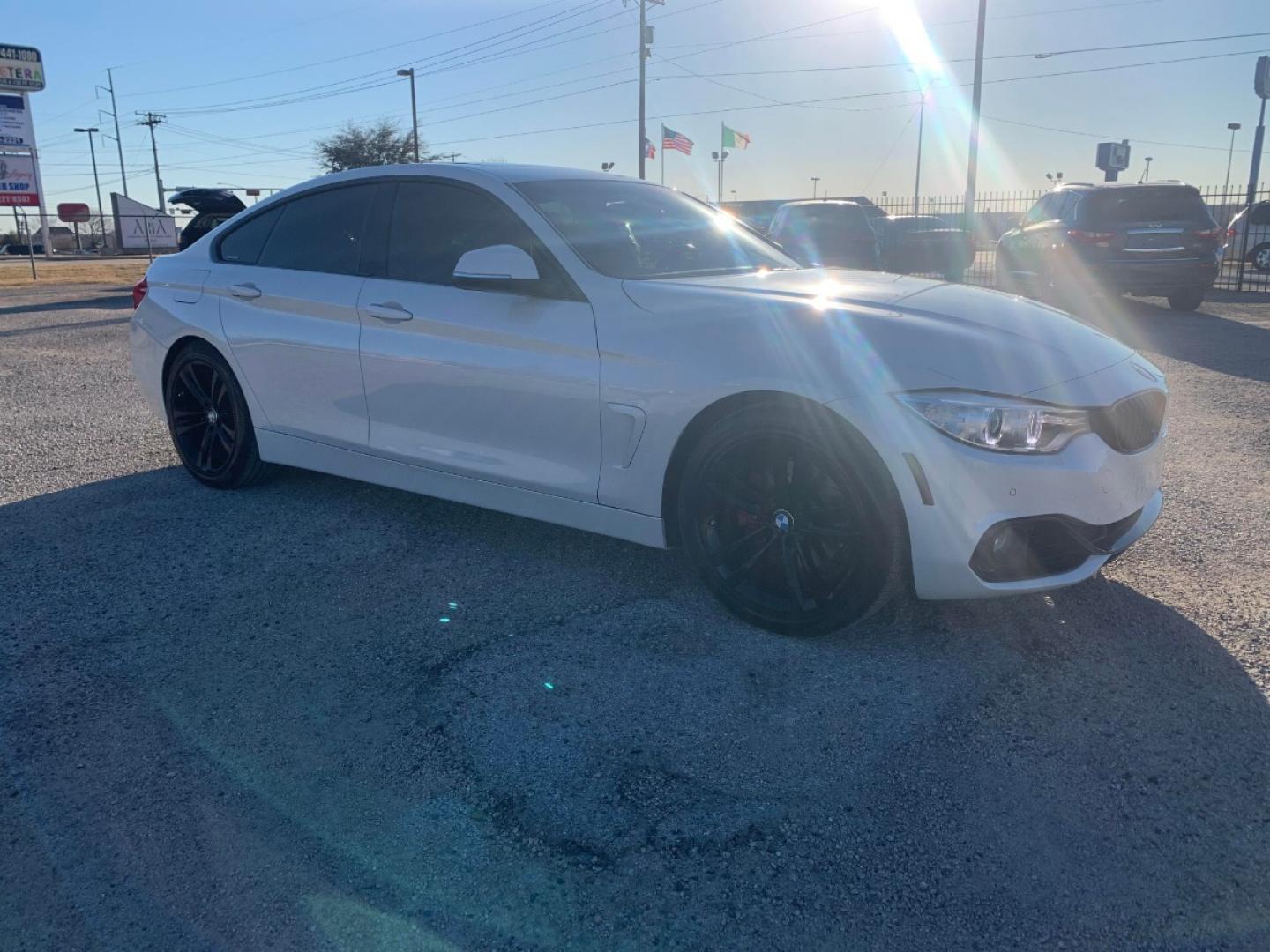 2016 White /Red BMW 4-Series Gran Coupe 428i SULEV (WBA4A9C59GG) with an 2.0L L4 DOHC 16V engine, 8A transmission, located at 1830 North Belt Line Road, Irving, TX, 75061, (469) 524-0199, 32.834373, -96.993584 - Owners personal vehicle. Runs and drives perfect! Rebuilt Title CASH ONLY CASH ONLY CASH ONLY CASH ONLY - Photo#3