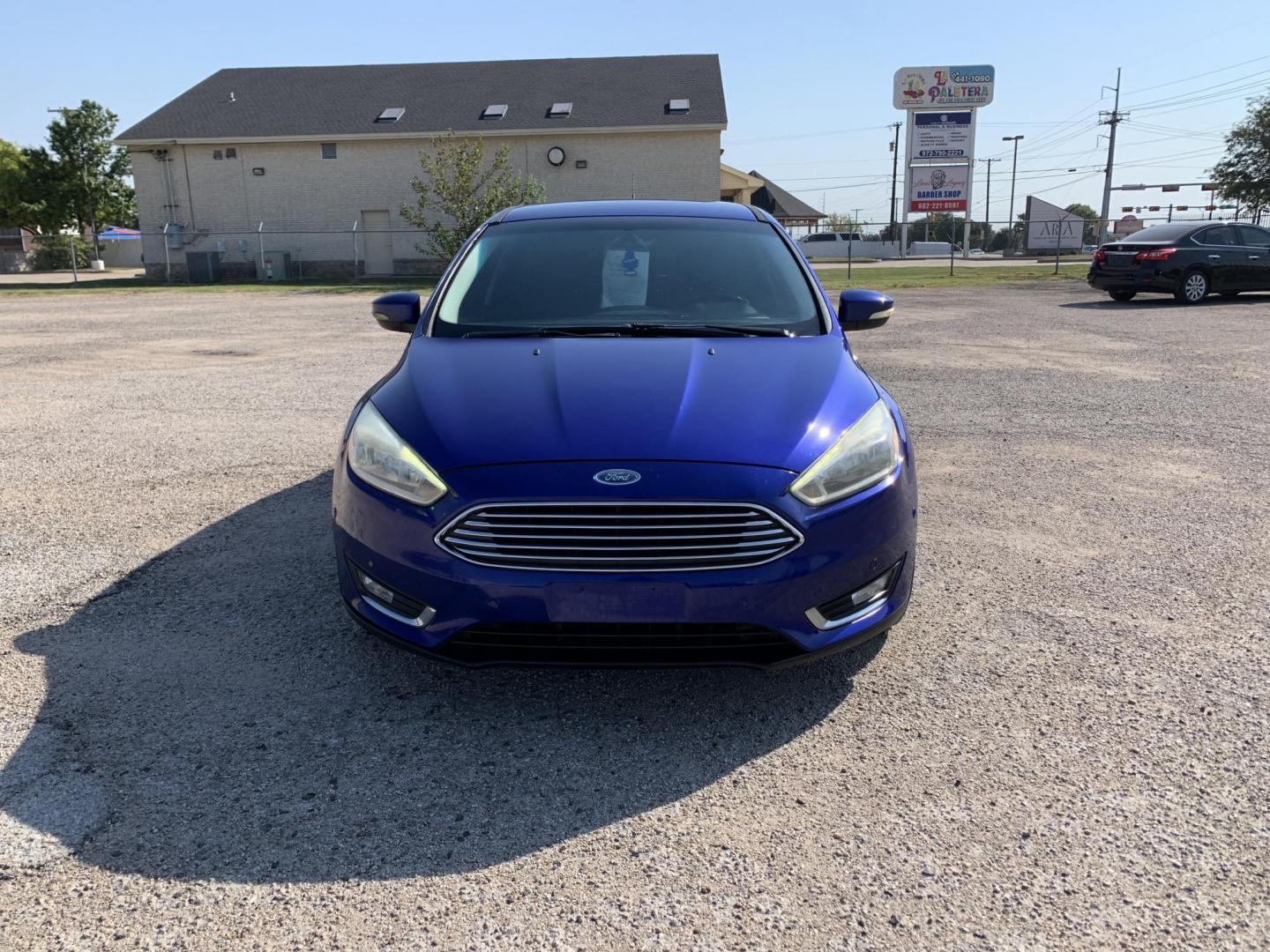 2015 Blue /Black Ford Focus Titanium Hatch (1FADP3N21FL) with an 2.0L L4 DOHC 16V engine, Automatic transmission, located at 1830 North Belt Line Road, Irving, TX, 75061, (469) 524-0199, 32.834373, -96.993584 - Photo#1