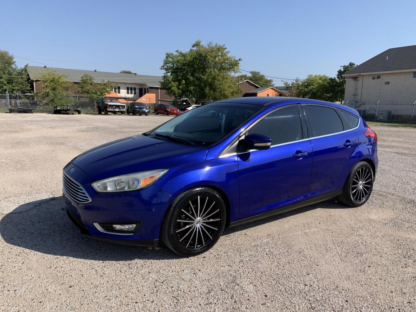 2015 Blue /Black Ford Focus Titanium Hatch (1FADP3N21FL) with an 2.0L L4 DOHC 16V engine, Automatic transmission, located at 1830 North Belt Line Road, Irving, TX, 75061, (469) 524-0199, 32.834373, -96.993584 - Photo#2