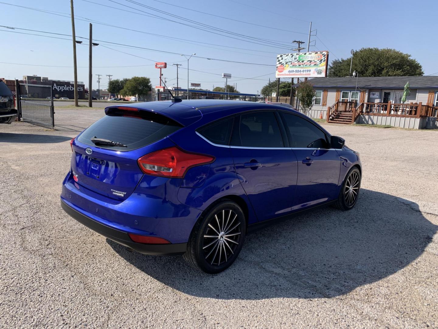 2015 Blue /Black Ford Focus Titanium Hatch (1FADP3N21FL) with an 2.0L L4 DOHC 16V engine, Automatic transmission, located at 1830 North Belt Line Road, Irving, TX, 75061, (469) 524-0199, 32.834373, -96.993584 - Photo#6