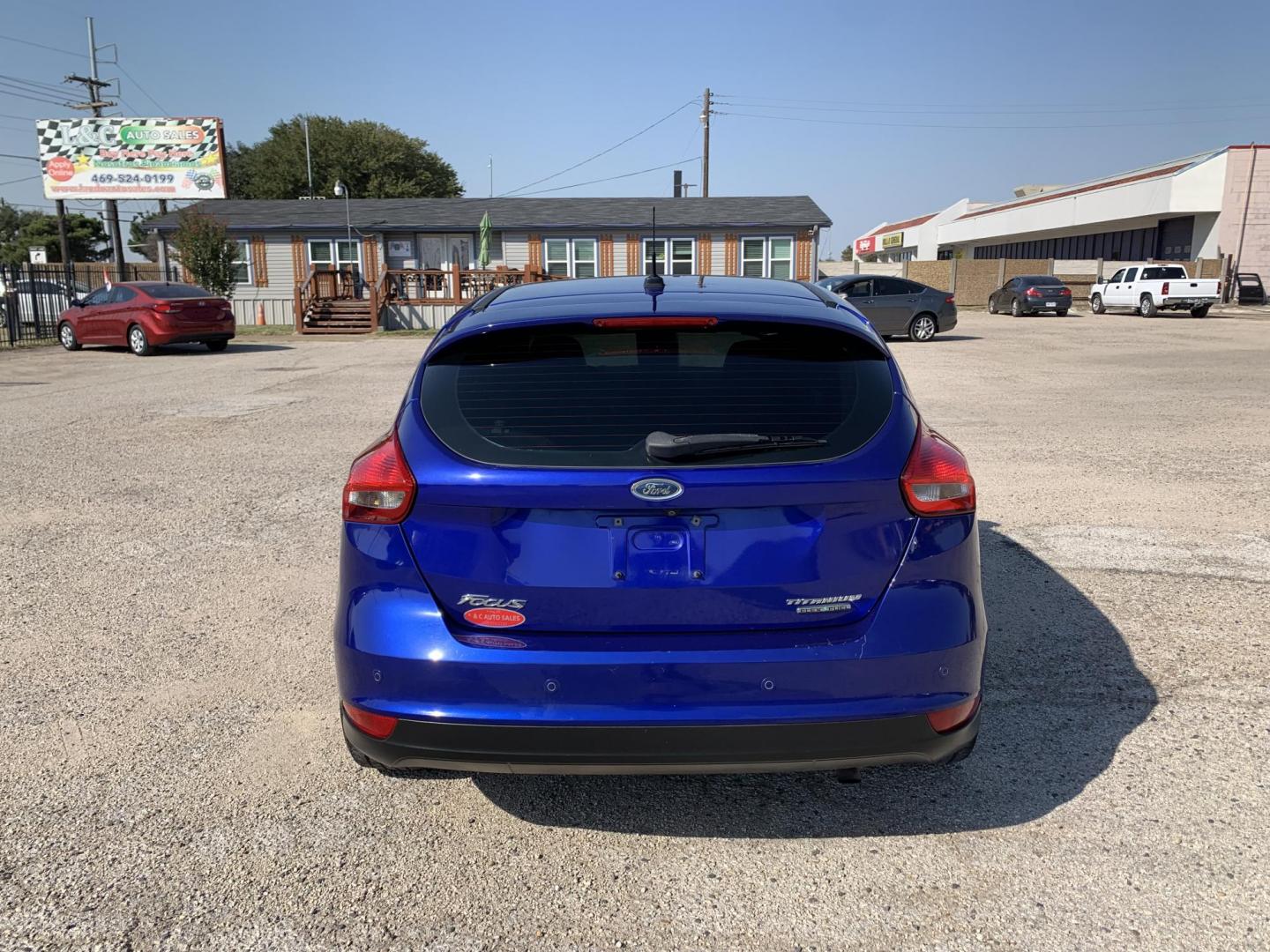 2015 Blue /Black Ford Focus Titanium Hatch (1FADP3N21FL) with an 2.0L L4 DOHC 16V engine, Automatic transmission, located at 1830 North Belt Line Road, Irving, TX, 75061, (469) 524-0199, 32.834373, -96.993584 - Photo#4