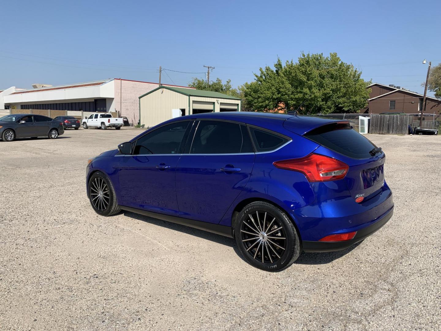 2015 Blue /Black Ford Focus Titanium Hatch (1FADP3N21FL) with an 2.0L L4 DOHC 16V engine, Automatic transmission, located at 1830 North Belt Line Road, Irving, TX, 75061, (469) 524-0199, 32.834373, -96.993584 - Photo#3