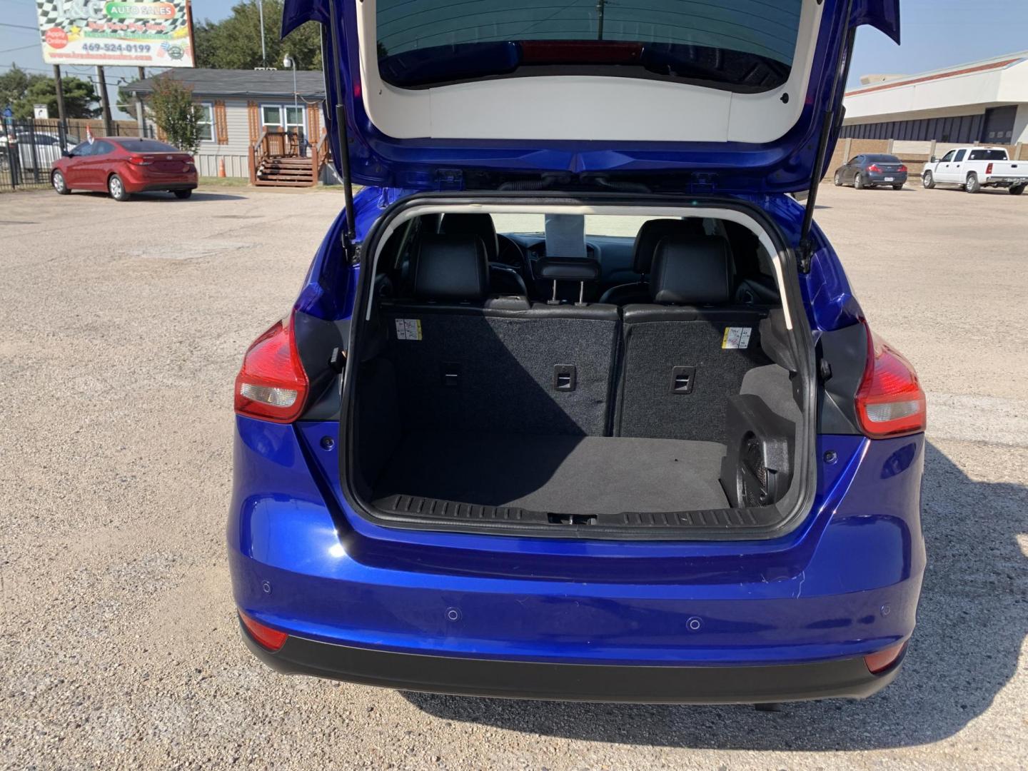 2015 Blue /Black Ford Focus Titanium Hatch (1FADP3N21FL) with an 2.0L L4 DOHC 16V engine, Automatic transmission, located at 1830 North Belt Line Road, Irving, TX, 75061, (469) 524-0199, 32.834373, -96.993584 - Photo#5