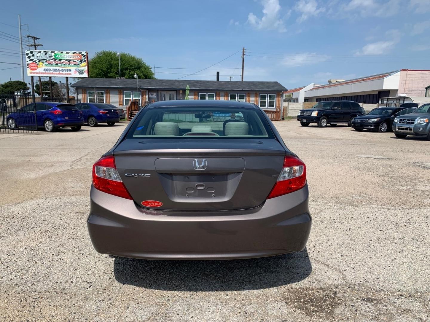 2012 Gold /Tan Honda Civic LX Sedan AT (2HGFB2F56CH) with an 1.8L L4 SOHC 16V engine, Automatic transmission, located at 1830 North Belt Line Road, Irving, TX, 75061, (469) 524-0199, 32.834373, -96.993584 - Photo#4