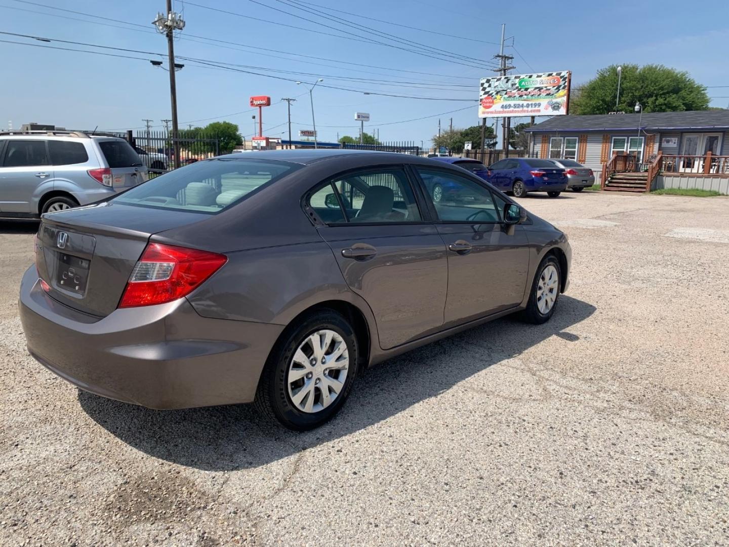 2012 Gold /Tan Honda Civic LX Sedan AT (2HGFB2F56CH) with an 1.8L L4 SOHC 16V engine, Automatic transmission, located at 1830 North Belt Line Road, Irving, TX, 75061, (469) 524-0199, 32.834373, -96.993584 - Photo#5