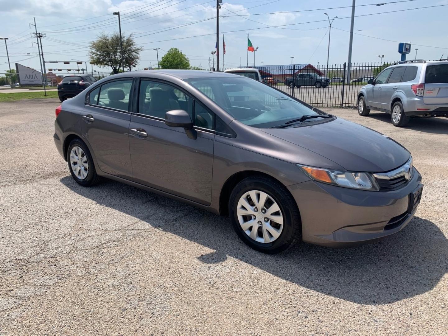 2012 Gold /Tan Honda Civic LX Sedan AT (2HGFB2F56CH) with an 1.8L L4 SOHC 16V engine, Automatic transmission, located at 1830 North Belt Line Road, Irving, TX, 75061, (469) 524-0199, 32.834373, -96.993584 - Photo#6