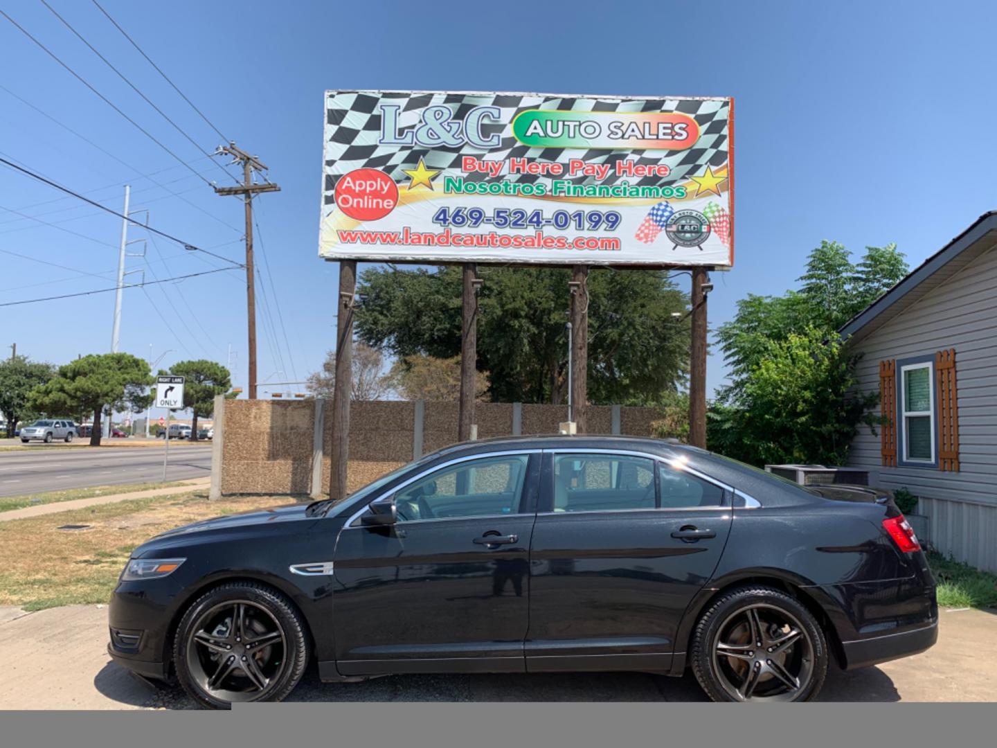 2014 Black /Tan Ford Taurus SEL FWD (1FAHP2E88EG) with an 3.5L V6 DOHC 24V engine, Automatic transmission, located at 1830 North Belt Line Road, Irving, TX, 75061, (469) 524-0199, 32.834373, -96.993584 - Photo#0