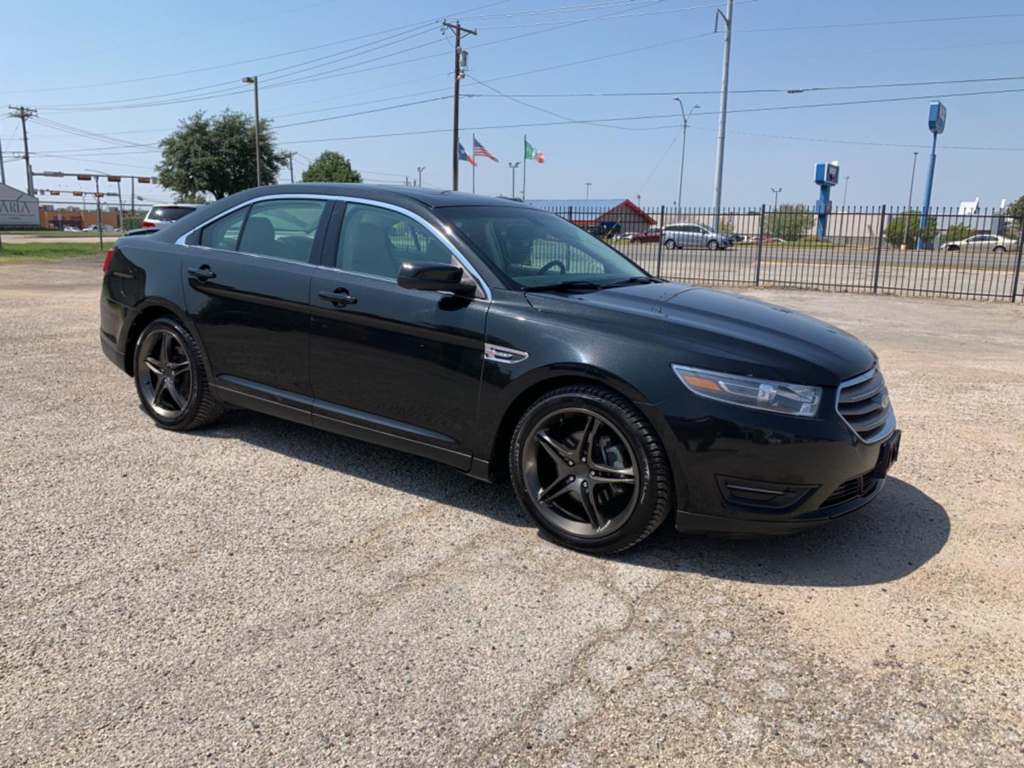 2014 Black /Tan Ford Taurus SEL FWD (1FAHP2E88EG) with an 3.5L V6 DOHC 24V engine, Automatic transmission, located at 1830 North Belt Line Road, Irving, TX, 75061, (469) 524-0199, 32.834373, -96.993584 - Photo#6