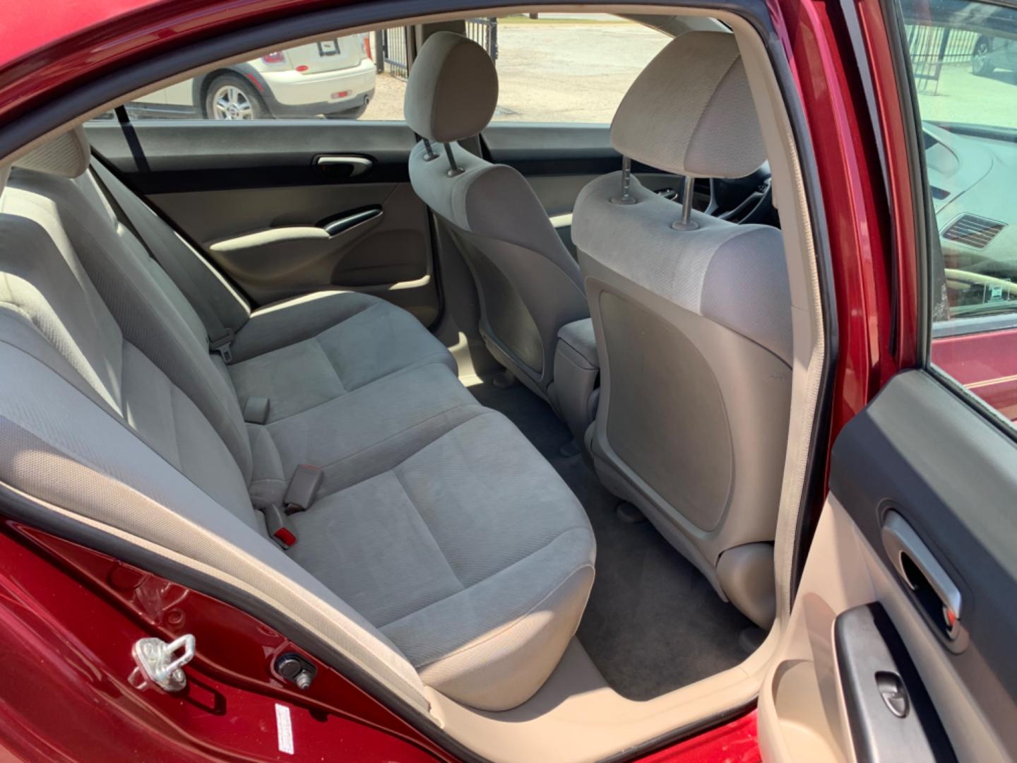 2009 Maroon /Tan Honda Civic LX (1HGFA16569L) with an 1.8L 1799cc GAS MFI type R18A1 - 4 valve SOHC engine, Automatic transmission, located at 1830 North Belt Line Road, Irving, TX, 75061, (469) 524-0199, 32.834373, -96.993584 - Photo#9