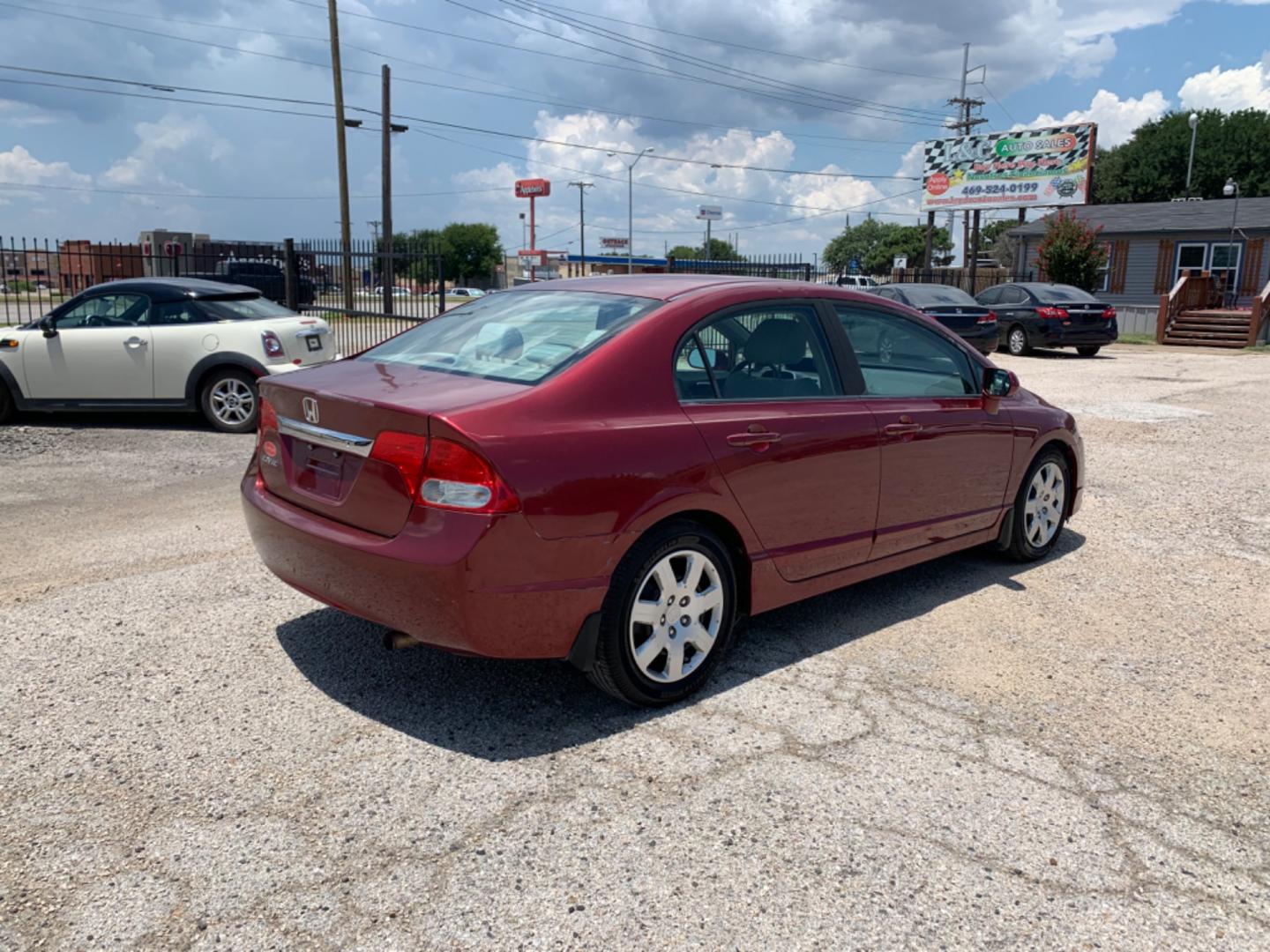 2009 Maroon /Tan Honda Civic LX (1HGFA16569L) with an 1.8L 1799cc GAS MFI type R18A1 - 4 valve SOHC engine, Automatic transmission, located at 1830 North Belt Line Road, Irving, TX, 75061, (469) 524-0199, 32.834373, -96.993584 - Photo#7