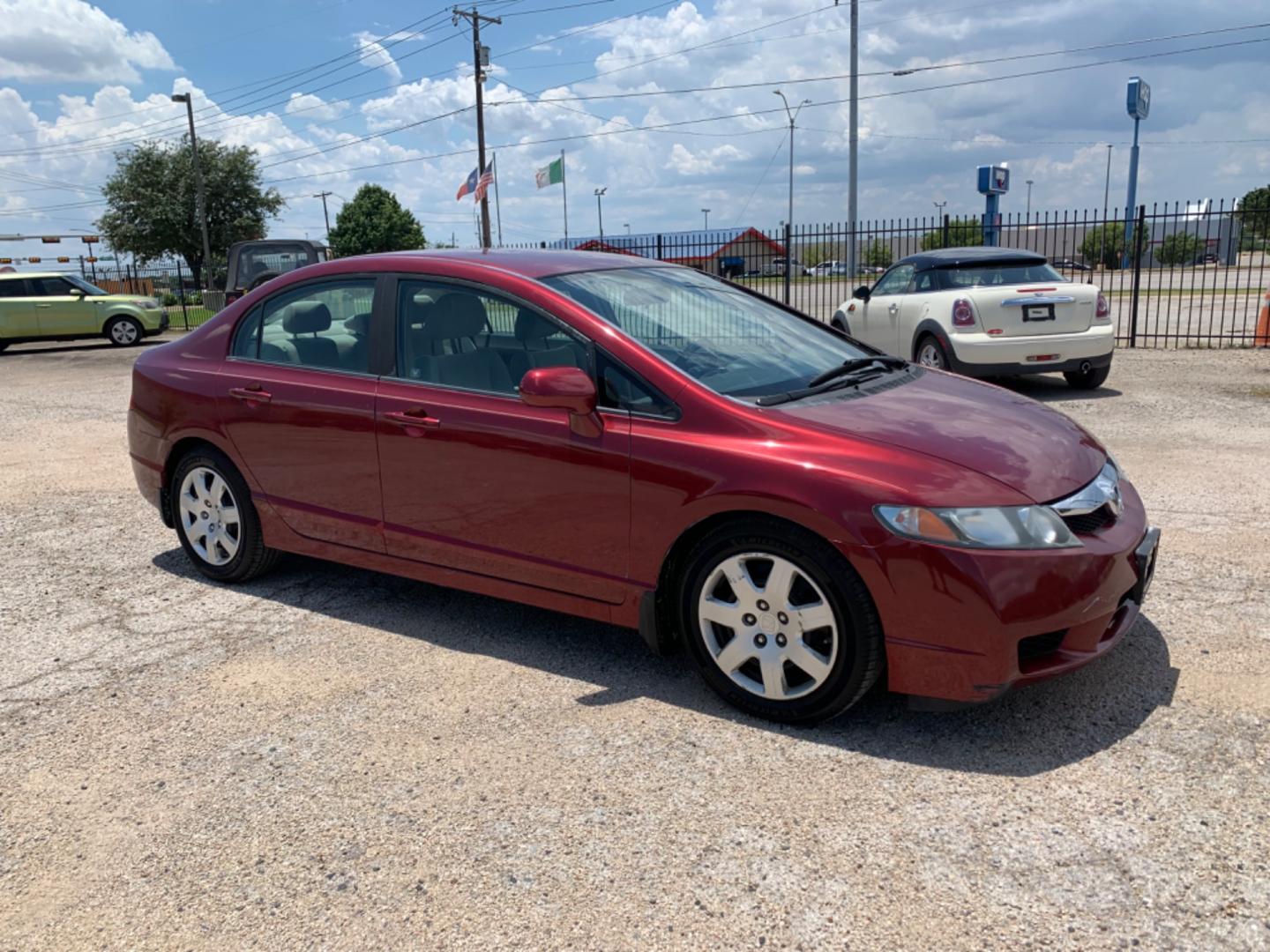 2009 Maroon /Tan Honda Civic LX (1HGFA16569L) with an 1.8L 1799cc GAS MFI type R18A1 - 4 valve SOHC engine, Automatic transmission, located at 1830 North Belt Line Road, Irving, TX, 75061, (469) 524-0199, 32.834373, -96.993584 - Photo#6