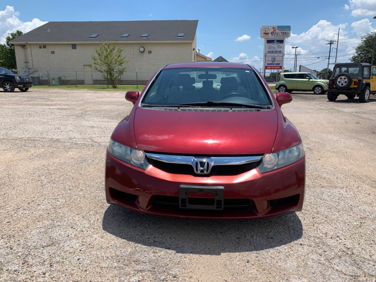 2009 Maroon /Tan Honda Civic LX (1HGFA16569L) with an 1.8L 1799cc GAS MFI type R18A1 - 4 valve SOHC engine, Automatic transmission, located at 1830 North Belt Line Road, Irving, TX, 75061, (469) 524-0199, 32.834373, -96.993584 - Photo#1