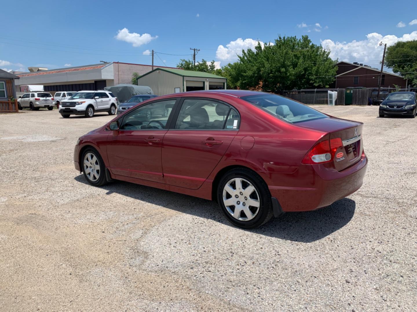 2009 Maroon /Tan Honda Civic LX (1HGFA16569L) with an 1.8L 1799cc GAS MFI type R18A1 - 4 valve SOHC engine, Automatic transmission, located at 1830 North Belt Line Road, Irving, TX, 75061, (469) 524-0199, 32.834373, -96.993584 - Photo#3