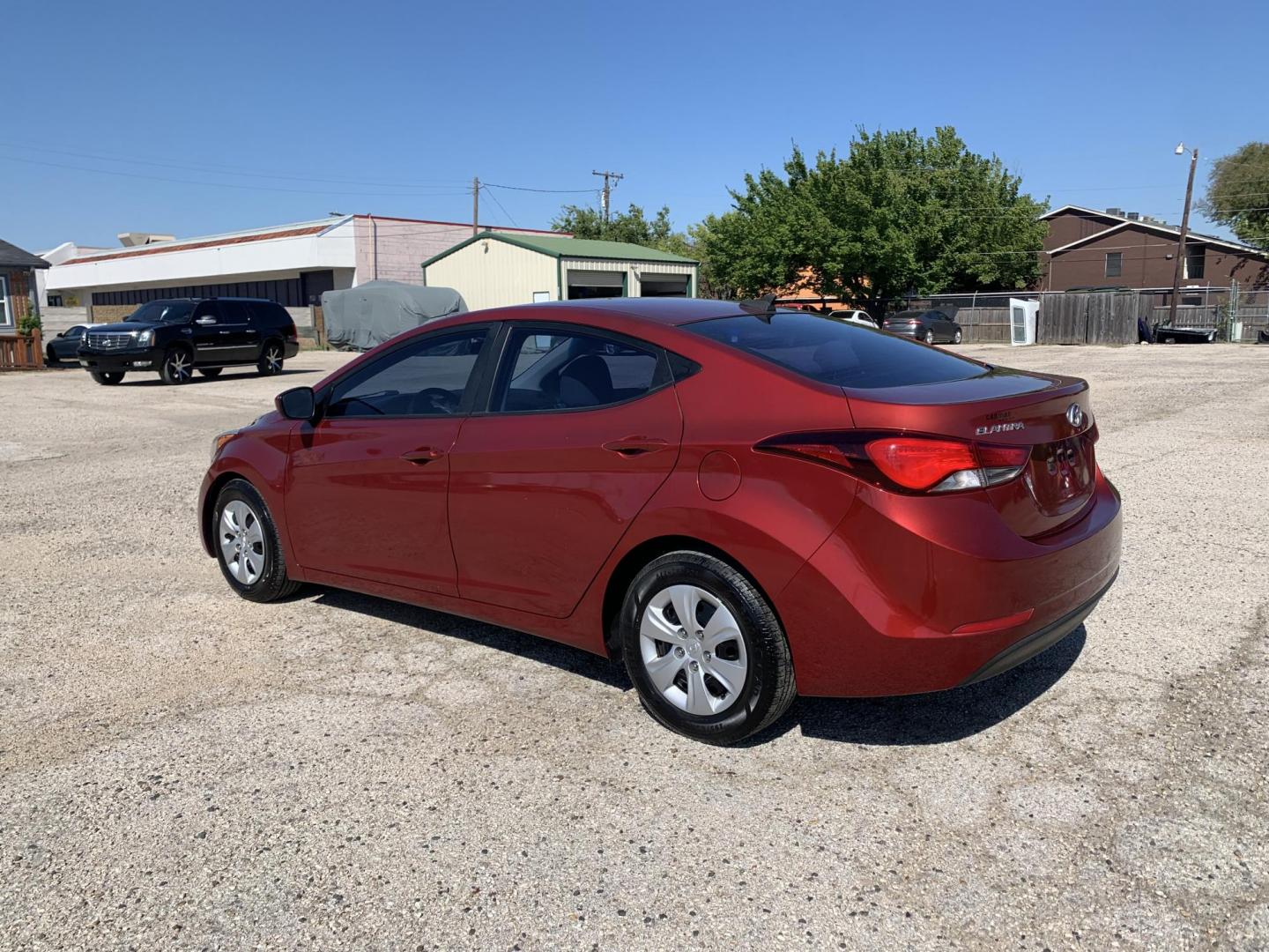 2016 Maroon /gray Hyundai Elantra Limited (5NPDH4AE2GH) with an 1.8L L4 DOHC 16V engine, Automatic transmission, located at 1830 North Belt Line Road, Irving, TX, 75061, (469) 524-0199, 32.834373, -96.993584 - Photo#3