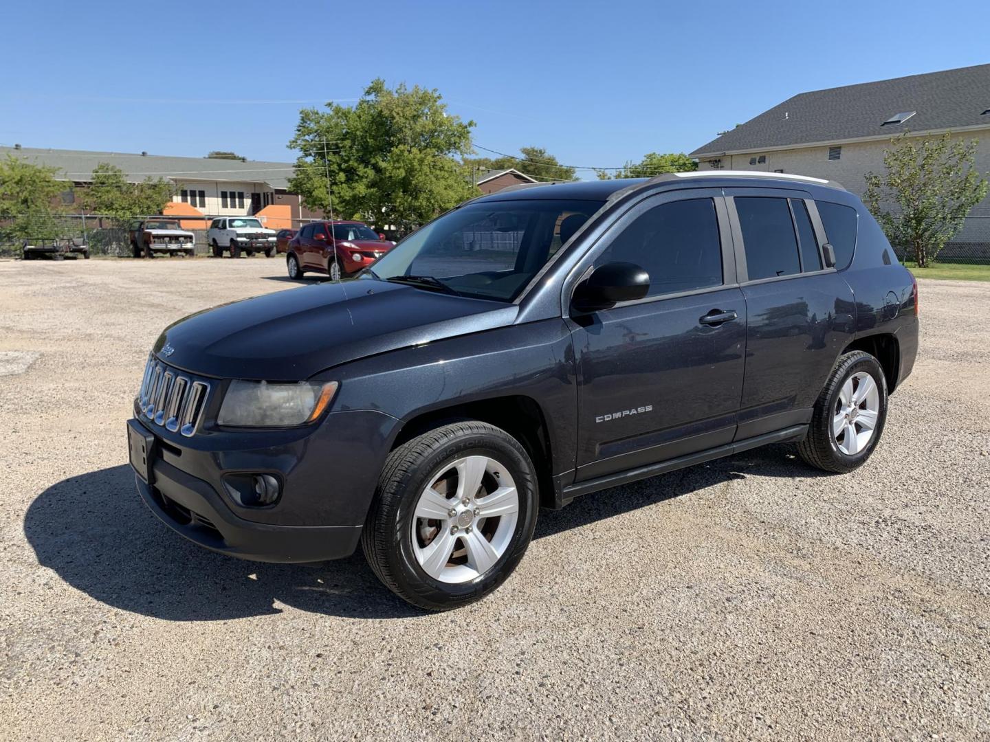 2016 Gray /Black Jeep Compass Sport FWD (1C4NJCBAXGD) with an 2.0L L4 DOHC 16V engine, AUTOMATIC transmission, located at 1830 North Belt Line Road, Irving, TX, 75061, (469) 524-0199, 32.834373, -96.993584 - Photo#2