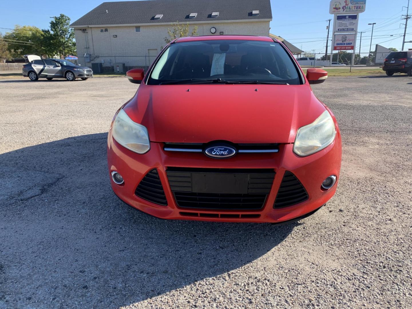 2012 Red /Black Ford Focus SEL (1FAHP3M23CL) with an 2.0L L4 DOHC 16V engine, Automatic transmission, located at 1830 North Belt Line Road, Irving, TX, 75061, (469) 524-0199, 32.834373, -96.993584 - Photo#1