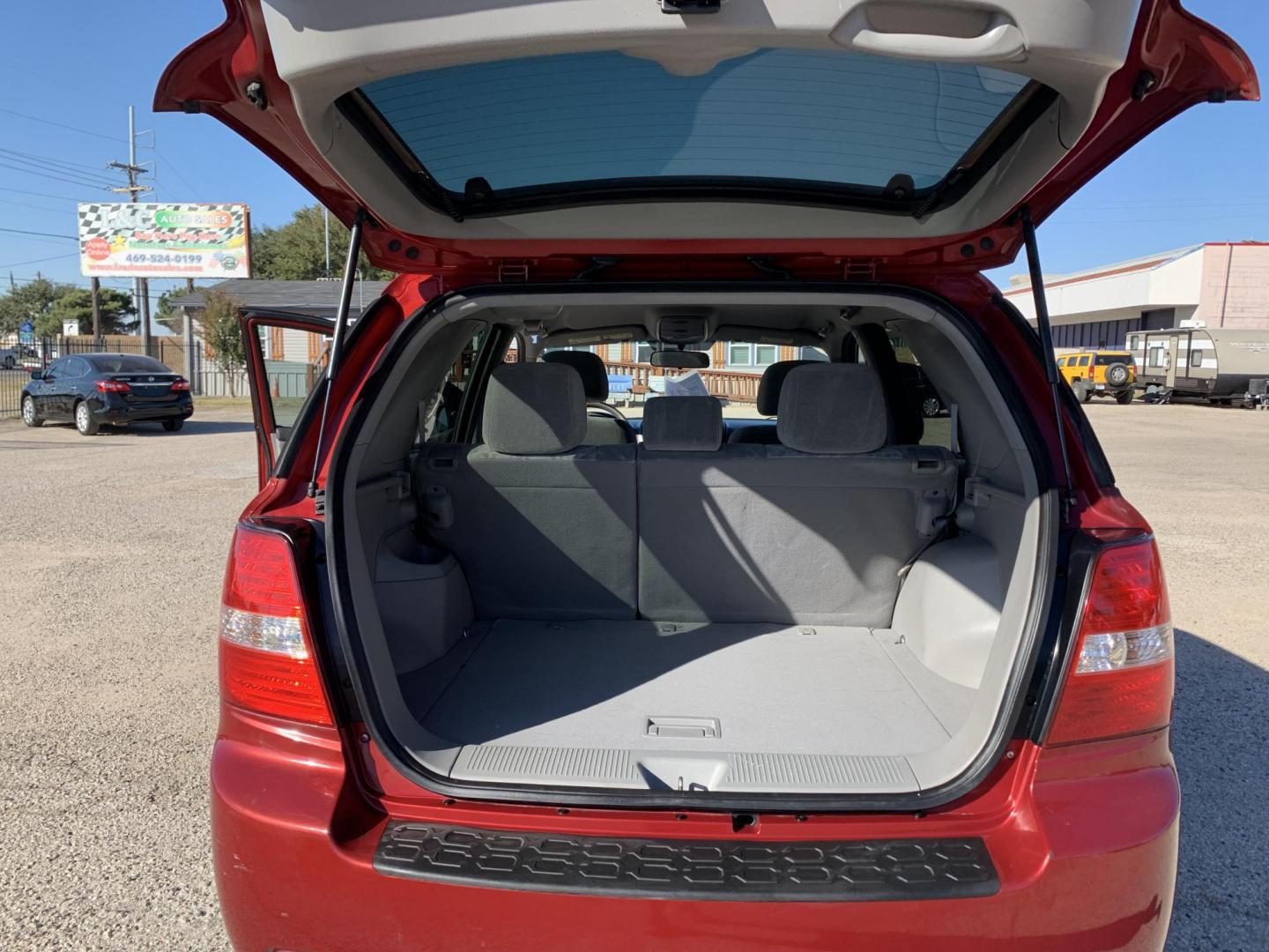 2008 Maroon /gray Kia Sorento Base (KNDJD735785) with an 3.3L V6 DOHC 24V engine, AUTOMATIC transmission, located at 1830 North Belt Line Road, Irving, TX, 75061, (469) 524-0199, 32.834373, -96.993584 - Photo#9