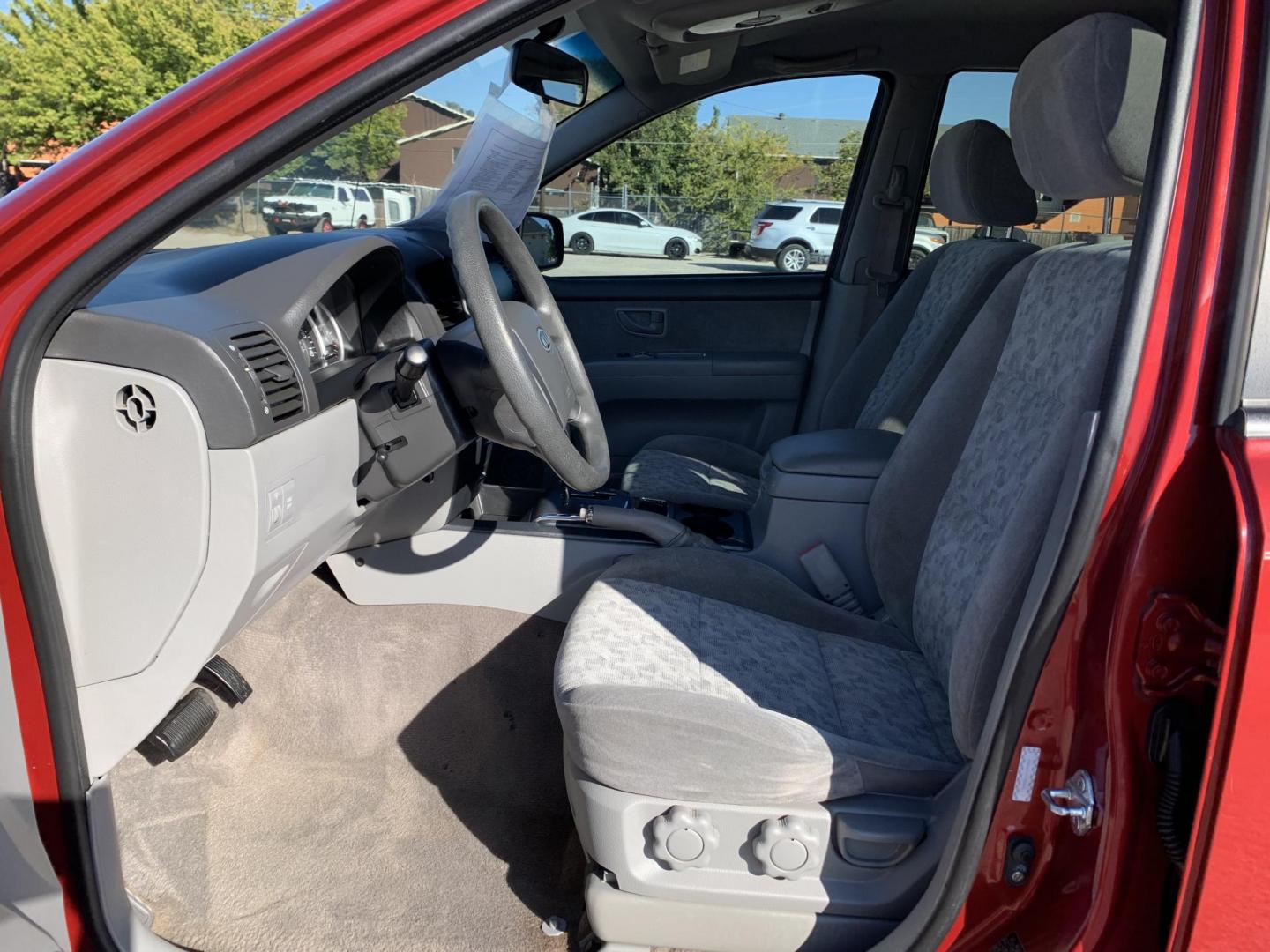 2008 Maroon /gray Kia Sorento Base (KNDJD735785) with an 3.3L V6 DOHC 24V engine, AUTOMATIC transmission, located at 1830 North Belt Line Road, Irving, TX, 75061, (469) 524-0199, 32.834373, -96.993584 - Photo#7