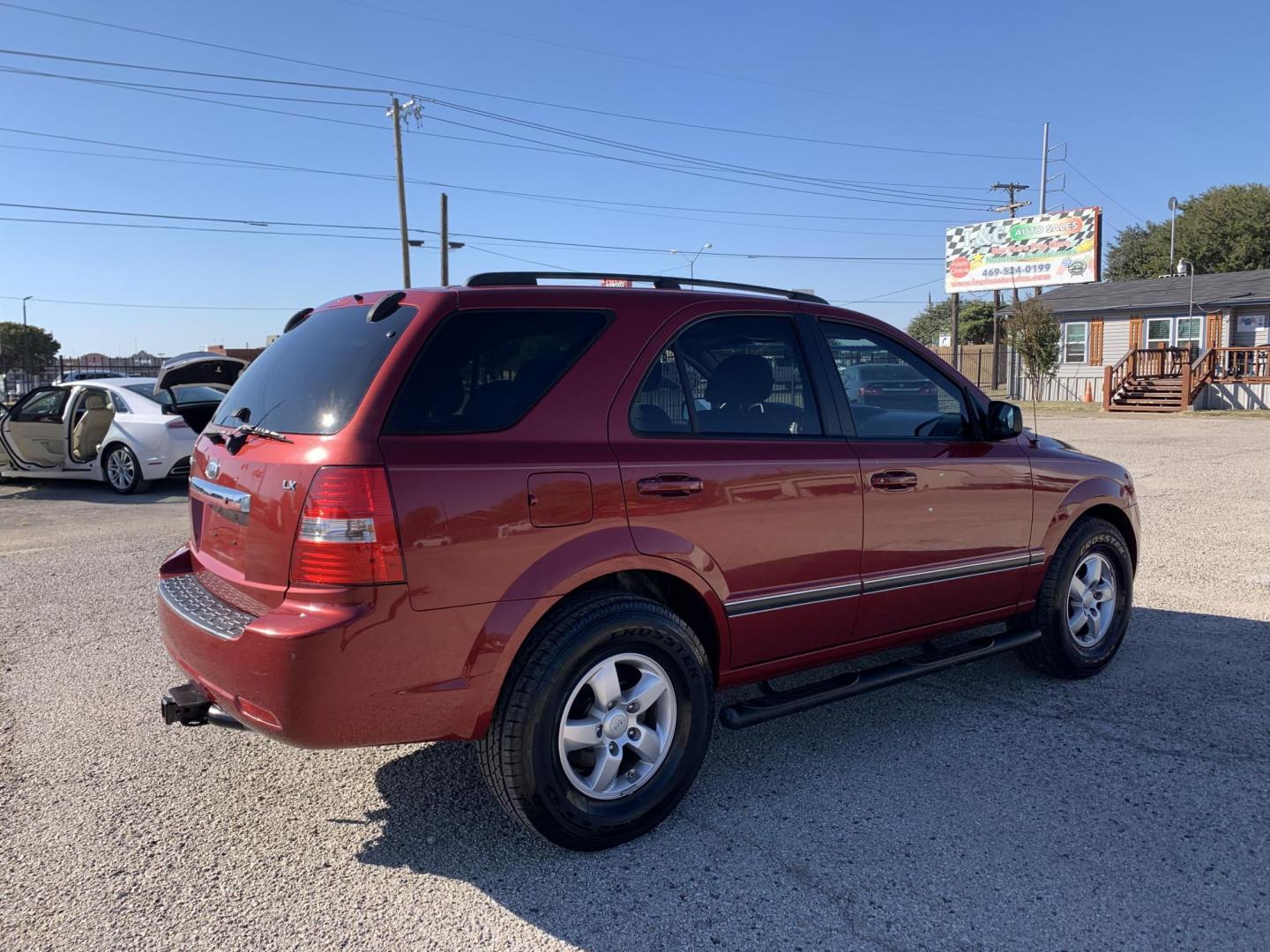 2008 Maroon /gray Kia Sorento Base (KNDJD735785) with an 3.3L V6 DOHC 24V engine, AUTOMATIC transmission, located at 1830 North Belt Line Road, Irving, TX, 75061, (469) 524-0199, 32.834373, -96.993584 - Photo#5