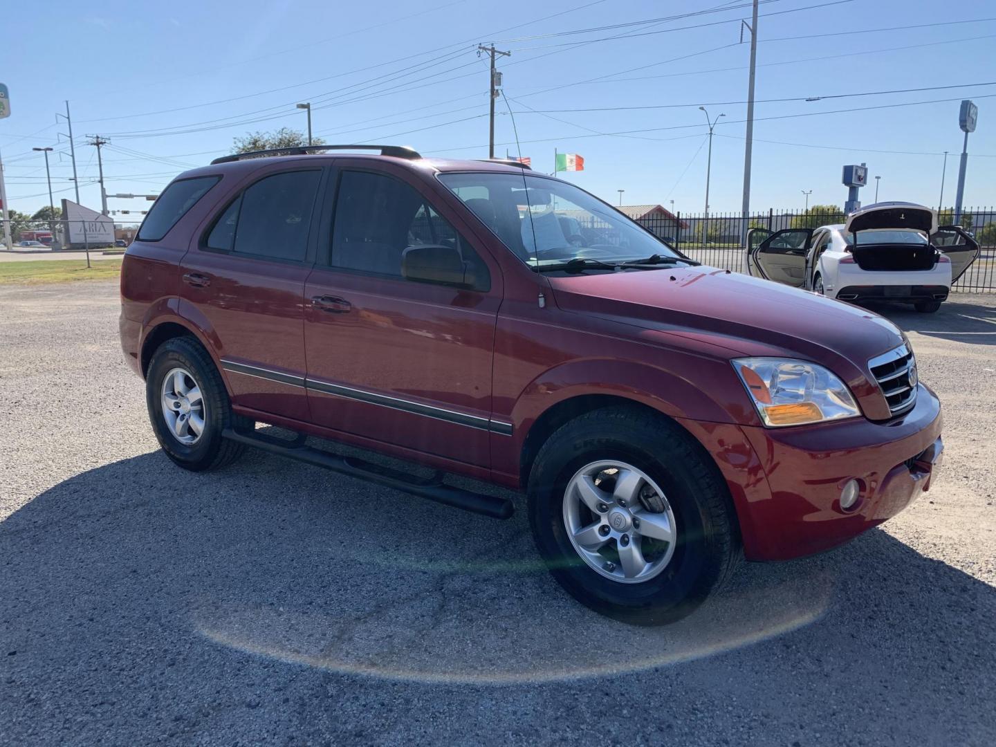 2008 Maroon /gray Kia Sorento Base (KNDJD735785) with an 3.3L V6 DOHC 24V engine, AUTOMATIC transmission, located at 1830 North Belt Line Road, Irving, TX, 75061, (469) 524-0199, 32.834373, -96.993584 - Photo#6