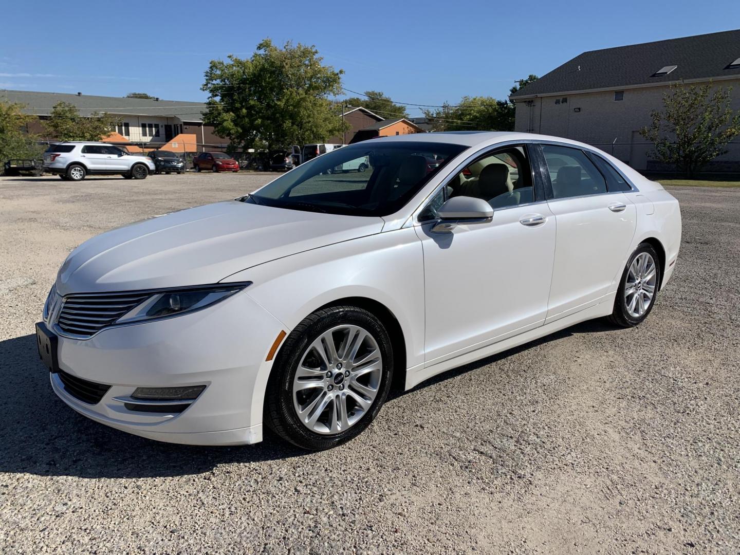 2014 White /Tan Lincoln MKZ FWD (3LN6L2G98ER) with an 2.0L L4 DOHC 16V engine, AUTOMATIC transmission, located at 1830 North Belt Line Road, Irving, TX, 75061, (469) 524-0199, 32.834373, -96.993584 - Photo#2