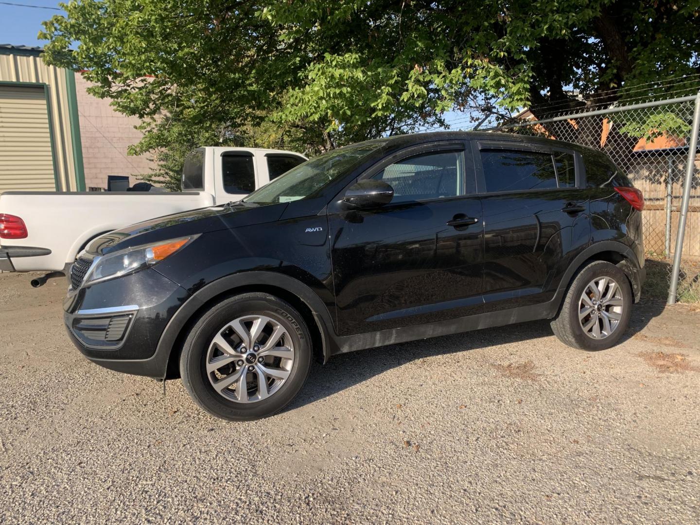 2015 Black /gray Kia Sportage LX AWD (KNDPBCAC9F7) with an 2.4L V6 DOHC 24V engine, AUTOMATIC transmission, located at 1830 North Belt Line Road, Irving, TX, 75061, (469) 524-0199, 32.834373, -96.993584 - Photo#0