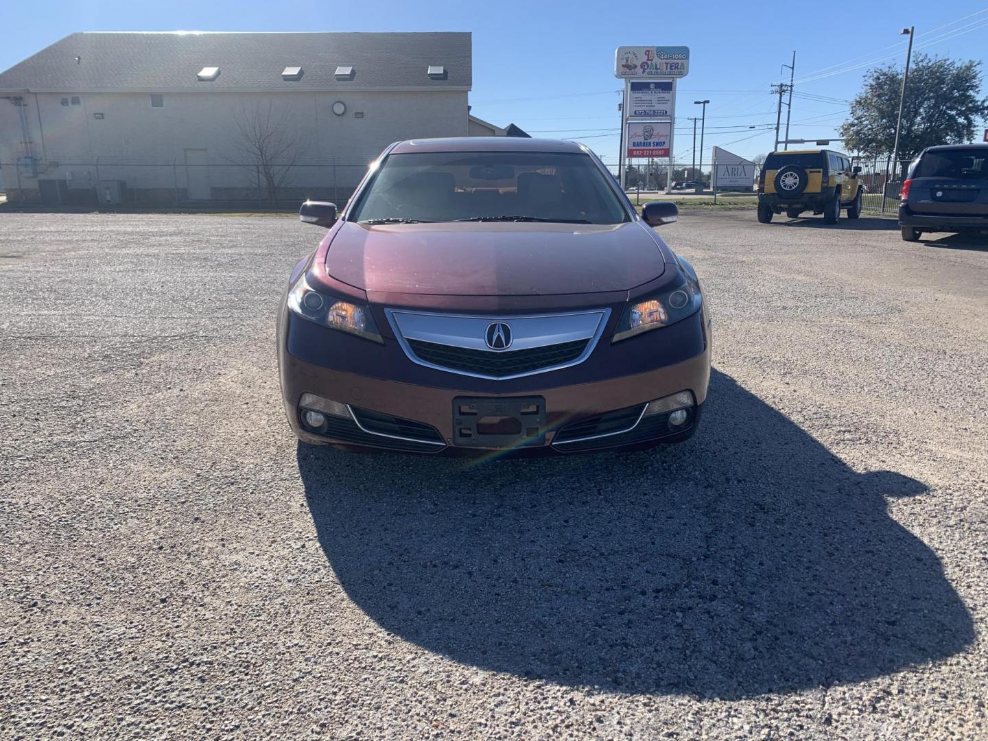 2012 Maroon /Tan Acura TL (19UUA8F26CA) with an 3.5L V6 SOHC 24V engine, Automatic transmission, located at 1830 North Belt Line Road, Irving, TX, 75061, (469) 524-0199, 32.834373, -96.993584 - Photo#1