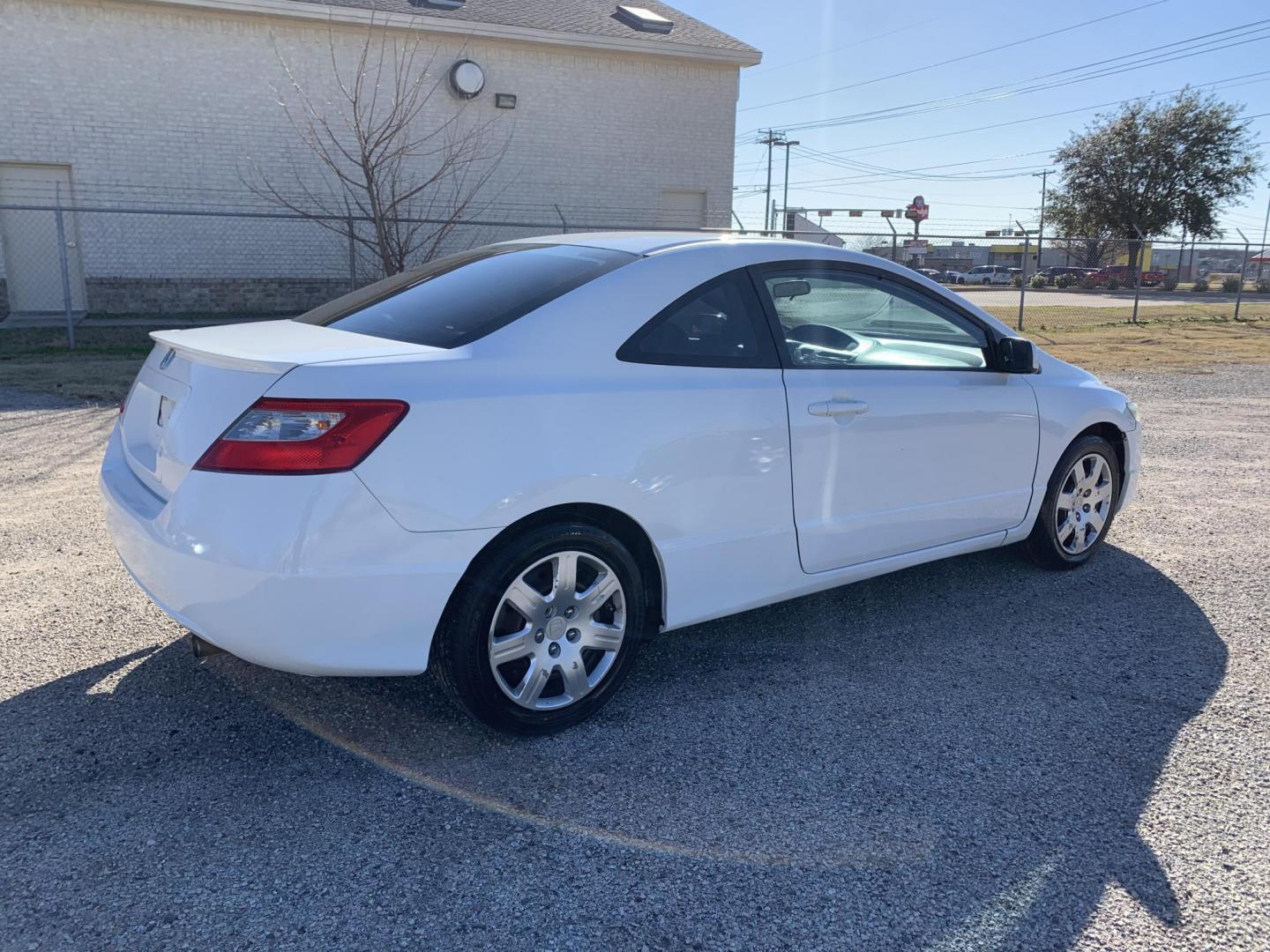 2009 White /gray Honda Civic LX Coupe (2HGFG12619H) with an 1.8L L4 SOHC 16V engine, AUTOMATIC transmission, located at 1830 North Belt Line Road, Irving, TX, 75061, (469) 524-0199, 32.834373, -96.993584 - Photo#3