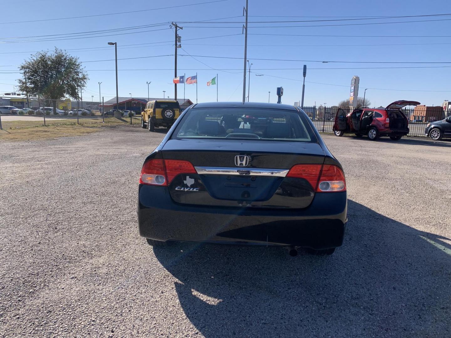 2010 Black /gray Honda Civic LX Sedan (19XFA1F56AE) with an 1.8L L4 SOHC 16V engine, Automatic transmission, located at 1830 North Belt Line Road, Irving, TX, 75061, (469) 524-0199, 32.834373, -96.993584 - Photo#3