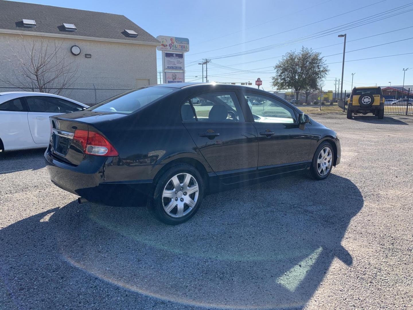 2010 Black /gray Honda Civic LX Sedan (19XFA1F56AE) with an 1.8L L4 SOHC 16V engine, Automatic transmission, located at 1830 North Belt Line Road, Irving, TX, 75061, (469) 524-0199, 32.834373, -96.993584 - Photo#4